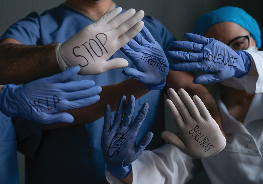 gloved healthcare hands and words to stop violence