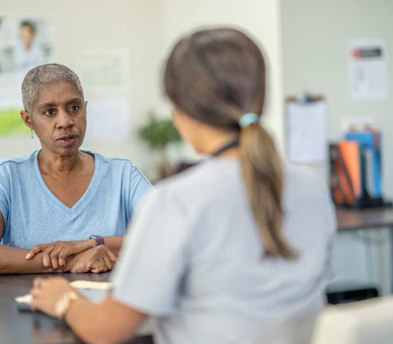 Nurse talking to a patient about test results