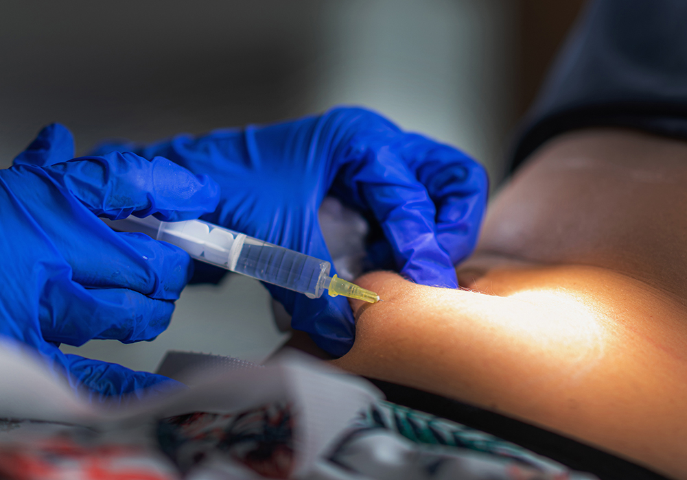 Nurse administering a subcutaneous injection