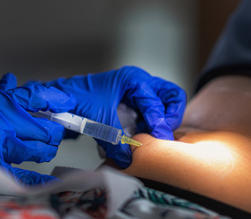 Nurse administering a subcutaneous injection