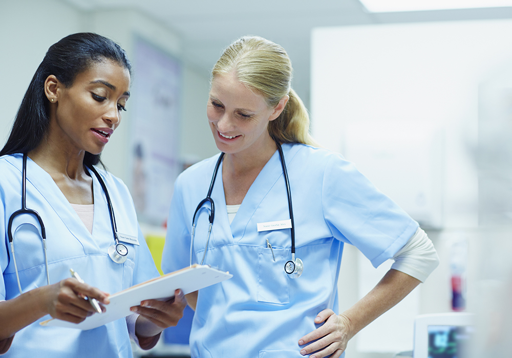 two female nurses having a conversation