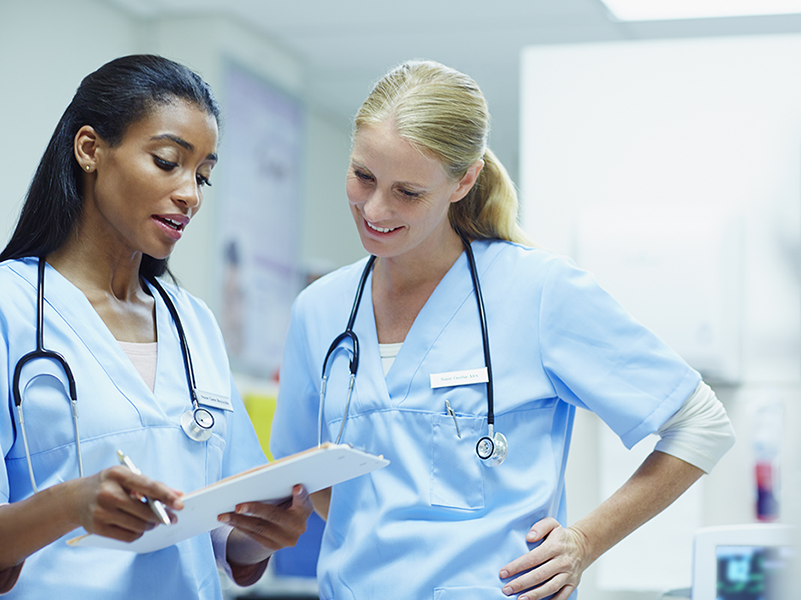 two female nurses having a conversation