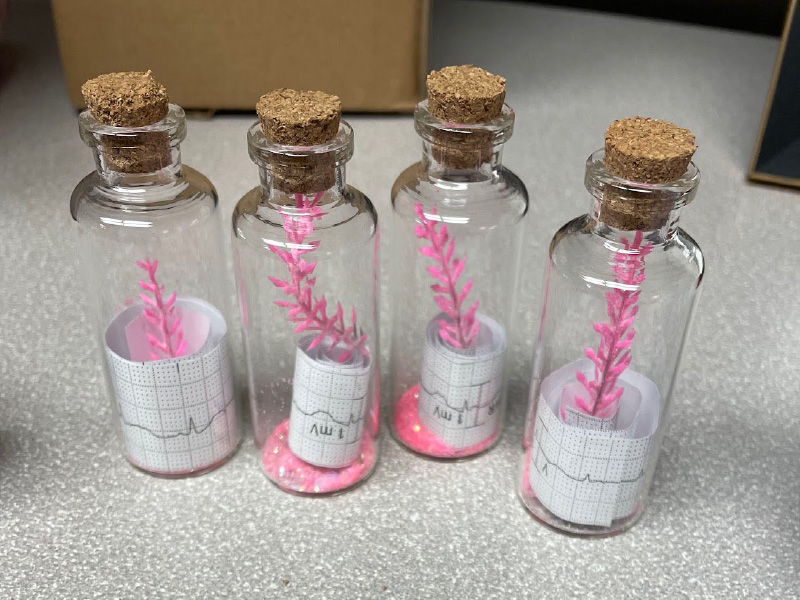 bottles with tags inside of them representing eol care