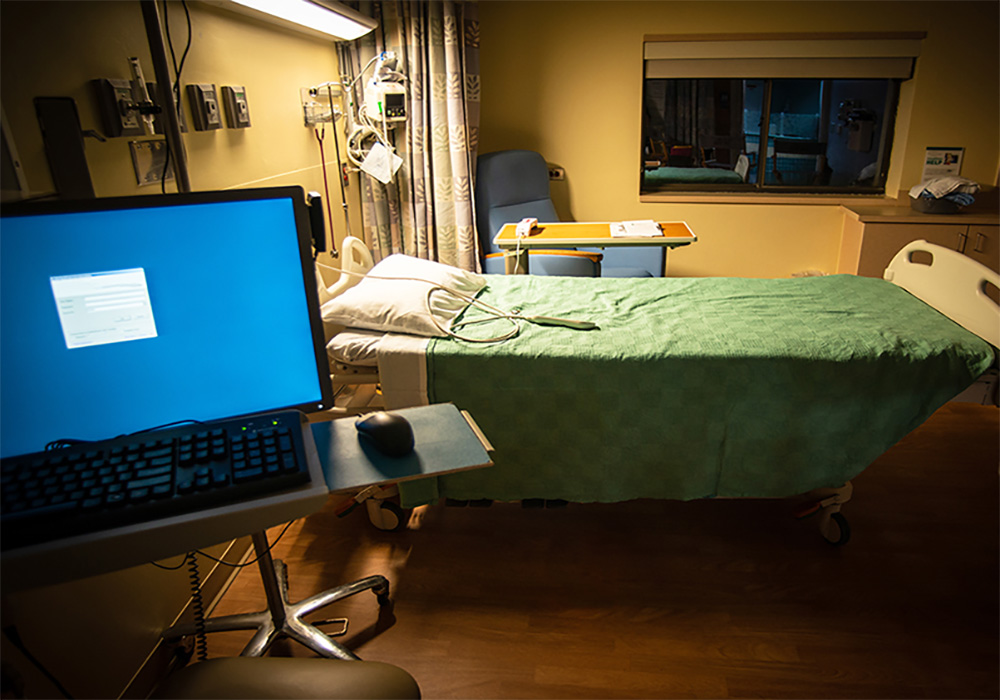 cozy hospital room with bed and computer