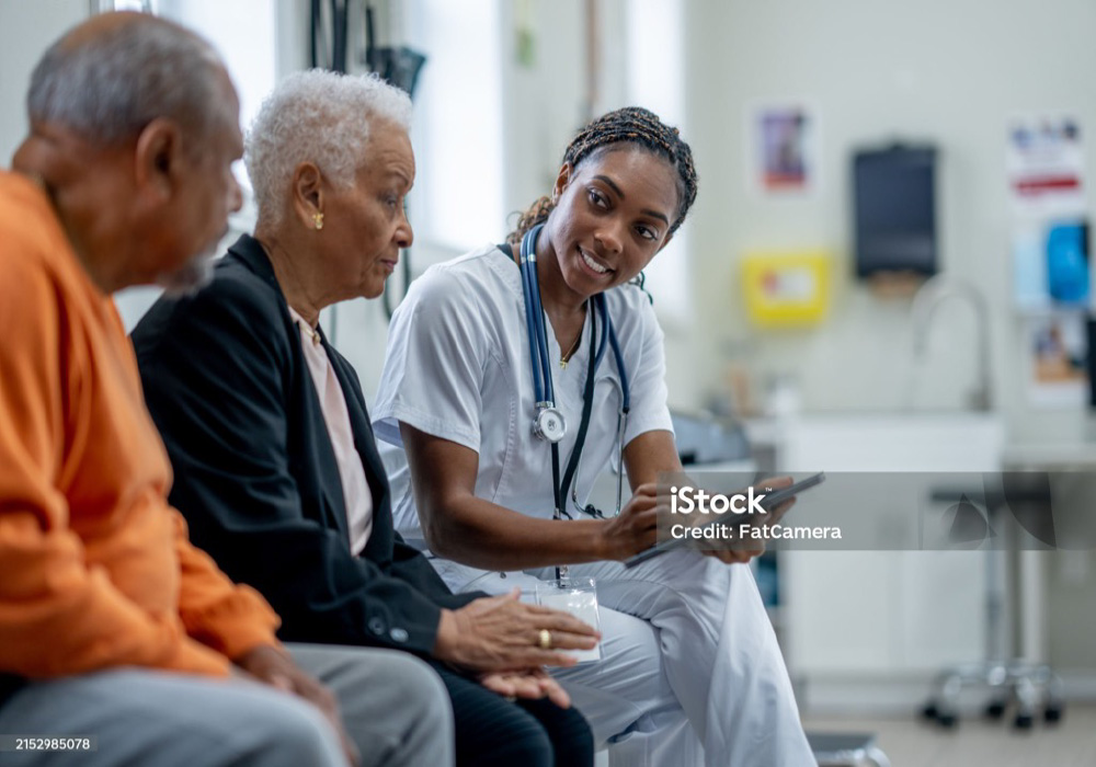 nurse in scrubs looking at diverse patients