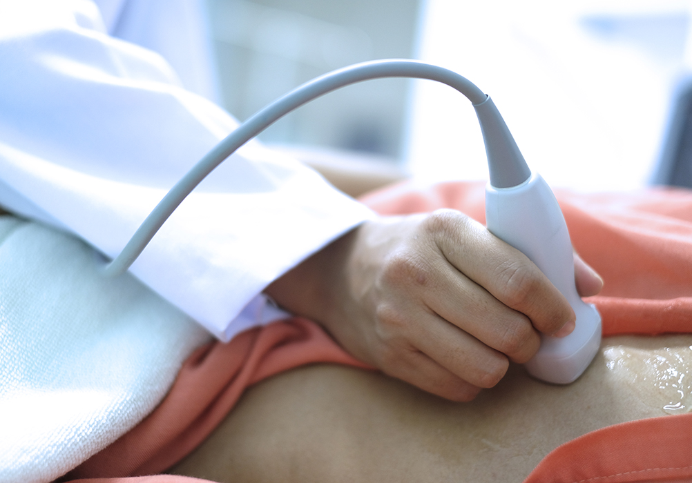 Nurse doing an ultrasound on patient