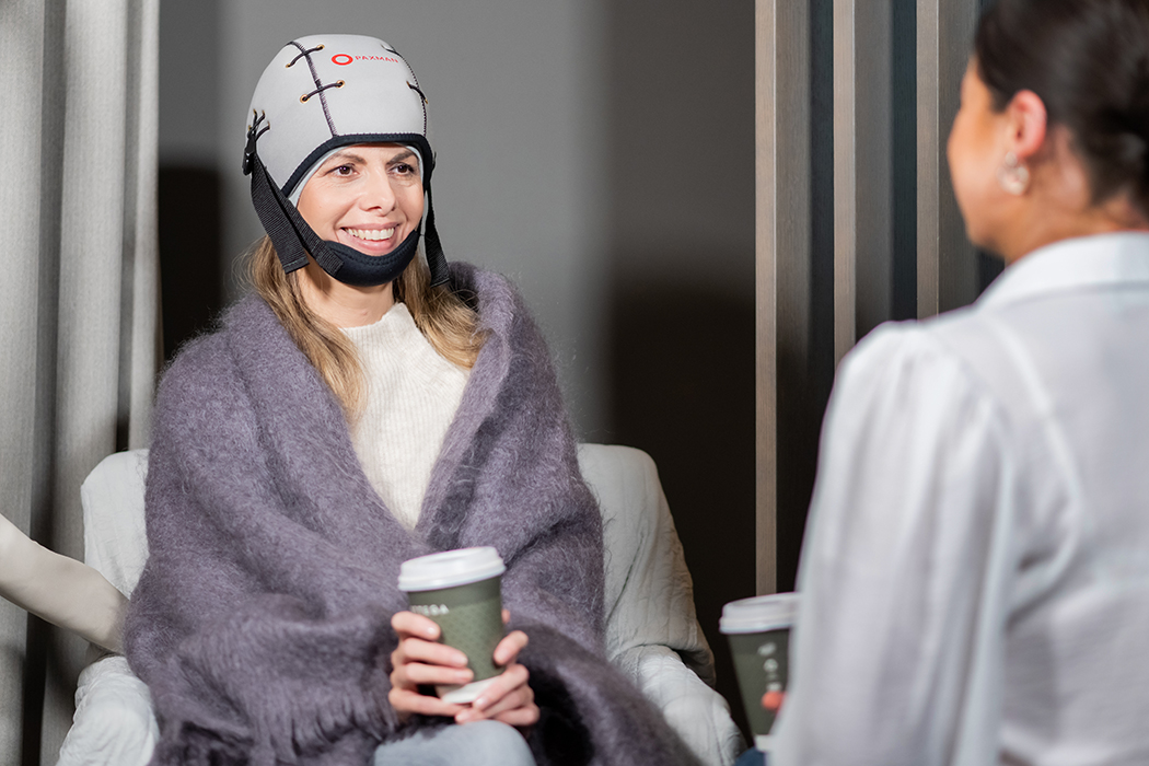 woman wearing scalp cooling cap