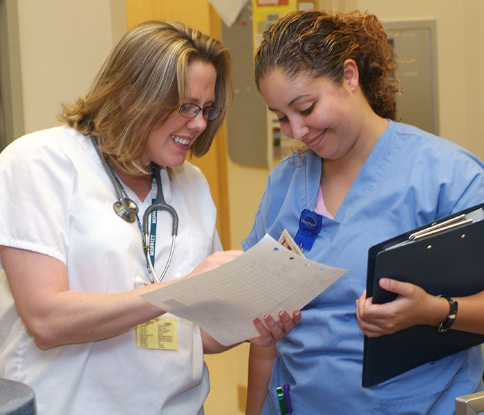 Nurses discussing safety report